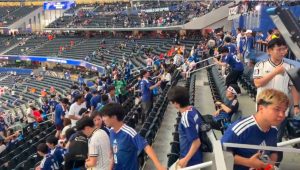 Japanese Fans Cleaning Stadium After Football Match