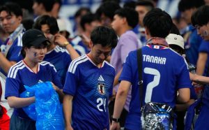 Japanese Fans Cleaning Stadium After Football Match
